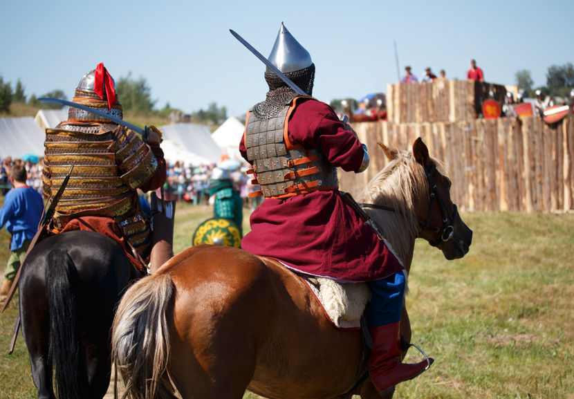 Two medievalists on horseback with Byzantine armor